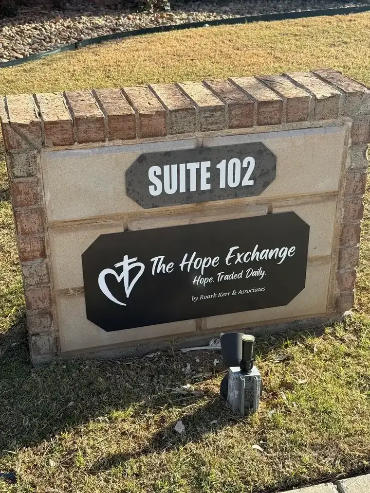 The monument sign outside The Hope Exchange at 6833 82nd Street in Lubbock, reading Hope. Traded Daily.
